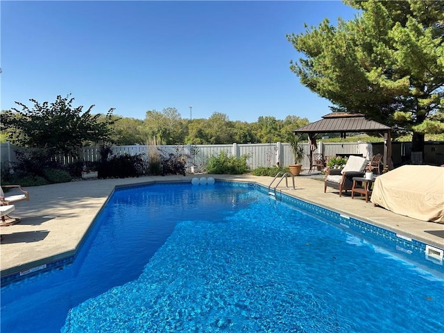 view of swimming pool featuring a gazebo and a patio area