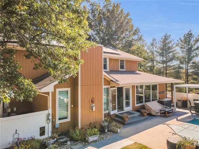 rear view of property featuring a patio area