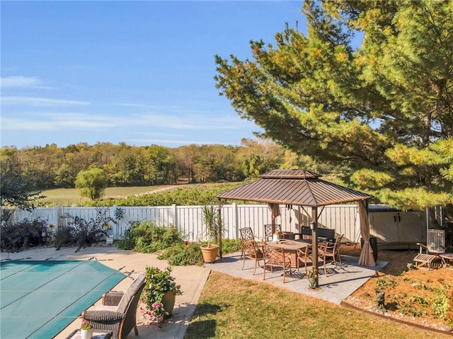 view of patio / terrace with a gazebo and a covered pool