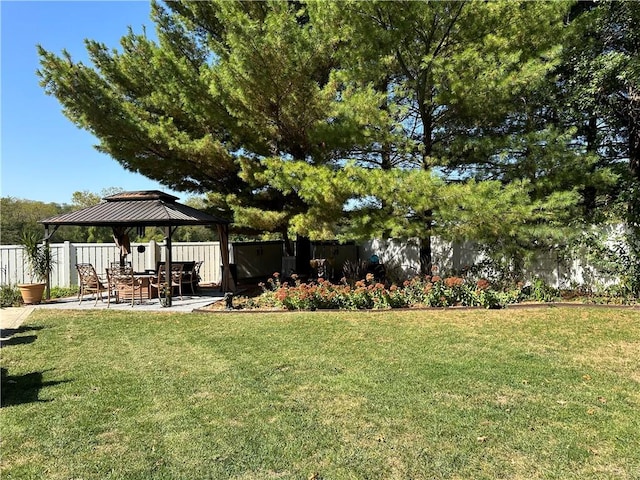 view of yard featuring a gazebo and a patio area