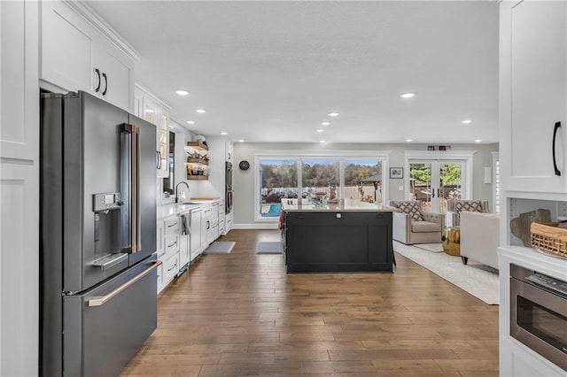 kitchen with french doors, sink, high end refrigerator, dark hardwood / wood-style floors, and white cabinets