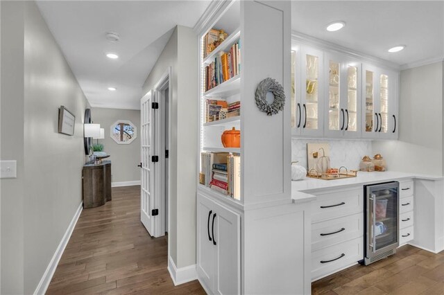 hall with dark hardwood / wood-style flooring and wine cooler