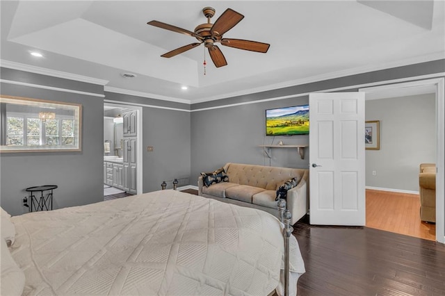 bedroom featuring ensuite bathroom, dark hardwood / wood-style flooring, ceiling fan, and ornamental molding