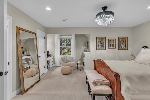 carpeted bedroom with a chandelier