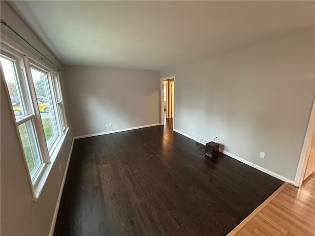 spare room featuring hardwood / wood-style floors