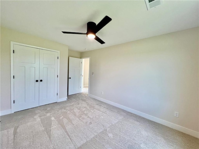 7709 NE 106th Pl, Kansas City, MO 64157 - unfurnished bedroom featuring light colored carpet, a closet, and ceiling fan