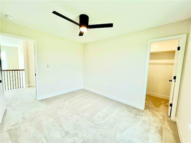 7709 NE 106th Pl, Kansas City, MO 64157 - unfurnished bedroom with a spacious closet, light colored carpet, ceiling fan, and a closet