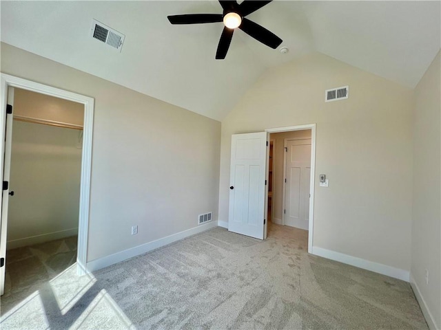 7709 NE 106th Pl, Kansas City, MO 64157 - unfurnished bedroom with light carpet, a spacious closet, lofted ceiling, and ceiling fan