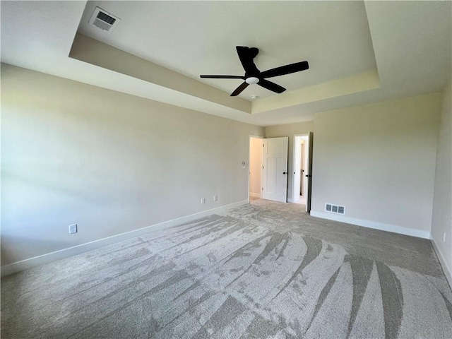 7709 NE 106th Pl, Kansas City, MO 64157 - carpeted spare room with a raised ceiling and ceiling fan