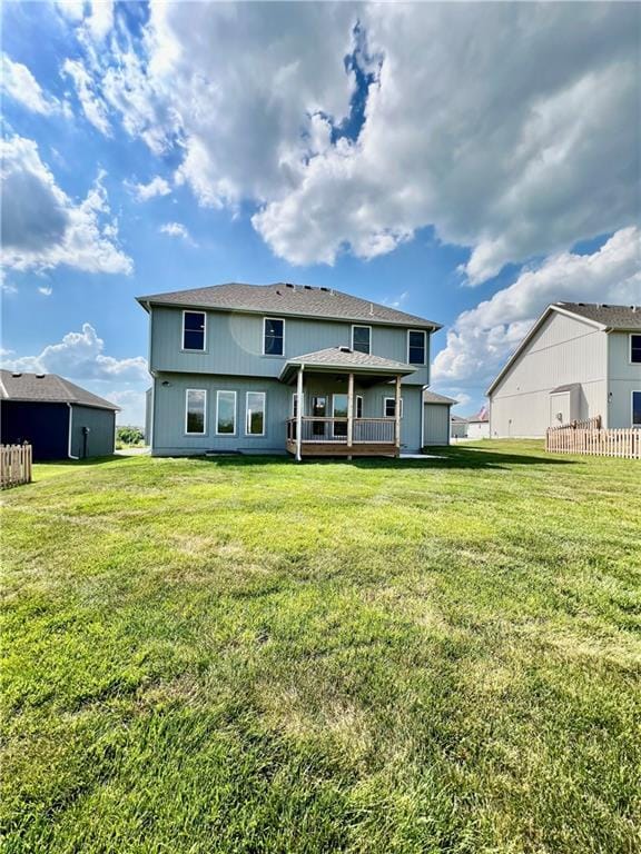 7709 NE 106th Pl, Kansas City, MO 64157 - back of house with a wooden deck