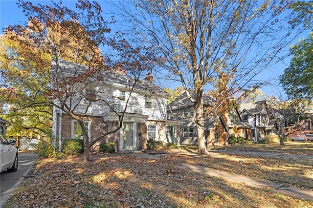 view of front of house featuring a balcony