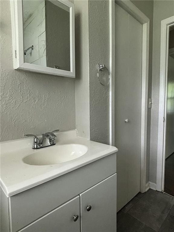 bathroom with vanity and tile patterned flooring