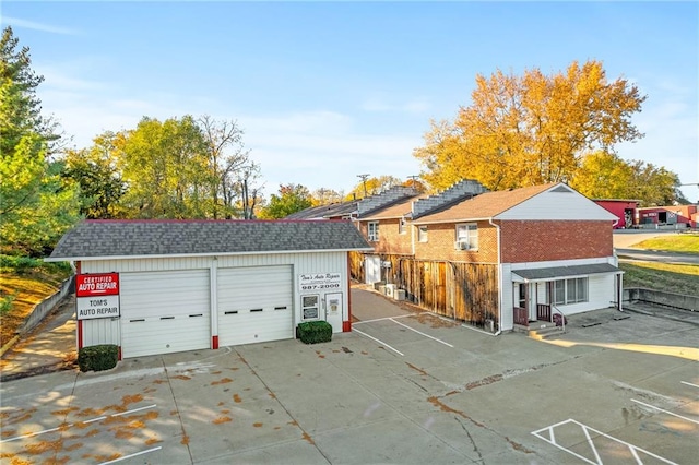 exterior space with an outdoor structure and a garage