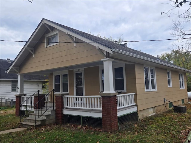 view of front of property featuring central AC and covered porch