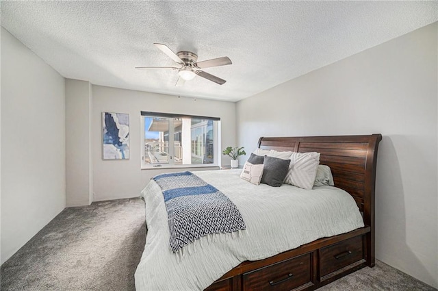 bedroom featuring carpet, ceiling fan, and a textured ceiling