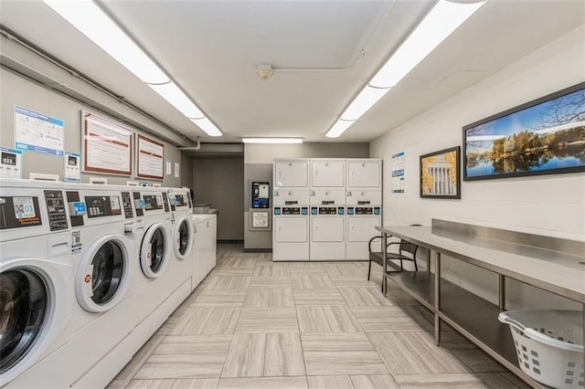 washroom featuring washing machine and dryer and stacked washer / dryer