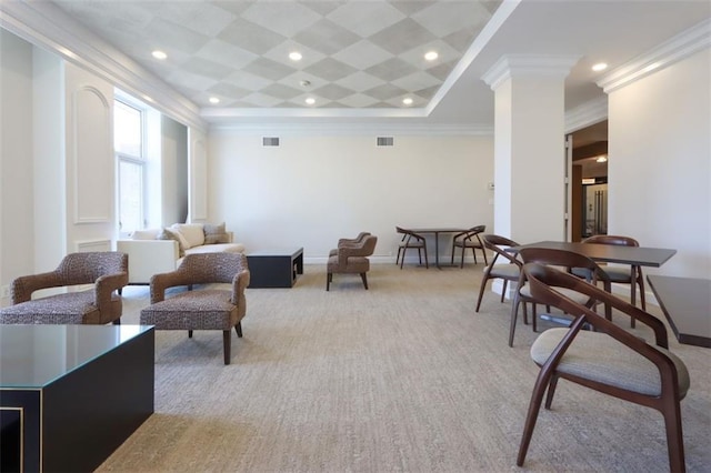 living room featuring a tray ceiling, ornate columns, and crown molding