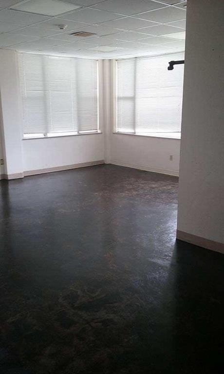 spare room featuring a paneled ceiling