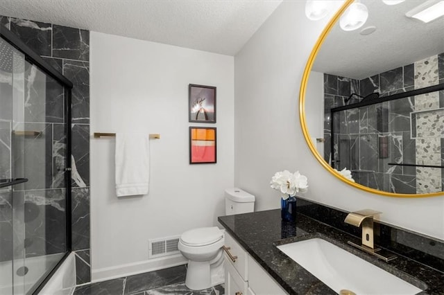 full bathroom with visible vents, toilet, vanity, shower / bath combination with glass door, and a textured ceiling