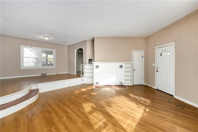 entryway with hardwood / wood-style flooring