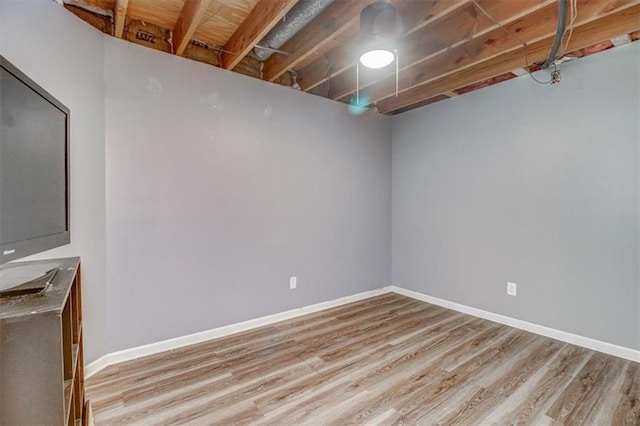 basement featuring light wood-type flooring