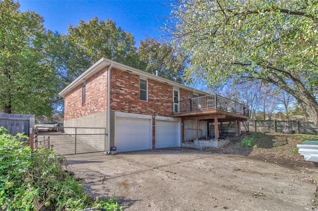 rear view of house featuring a garage