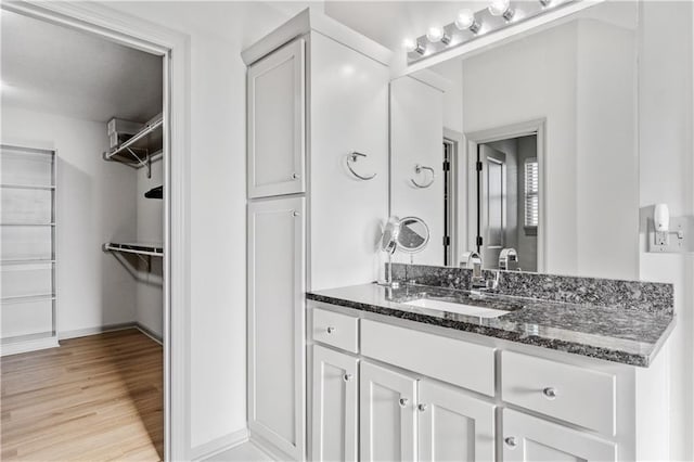 bathroom featuring hardwood / wood-style floors and vanity