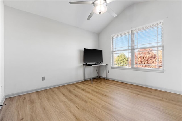 unfurnished bedroom with ceiling fan, light wood-type flooring, and vaulted ceiling