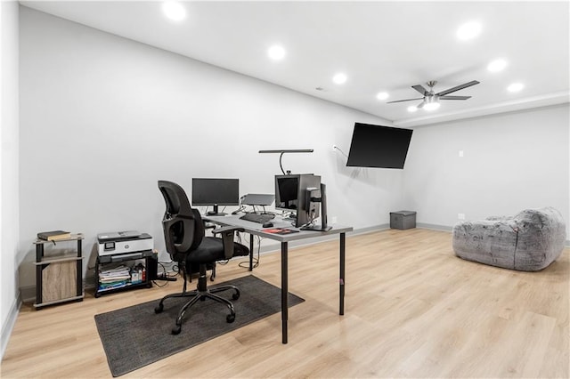 office space with ceiling fan and light hardwood / wood-style floors