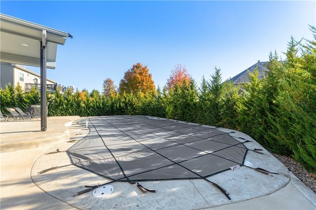 view of swimming pool with a patio