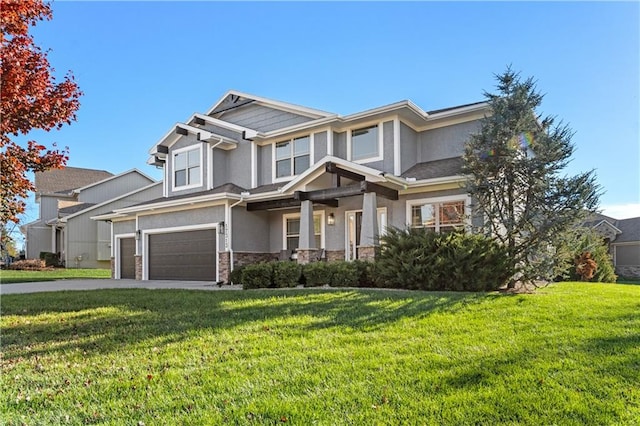 view of front of property featuring a front yard and a garage