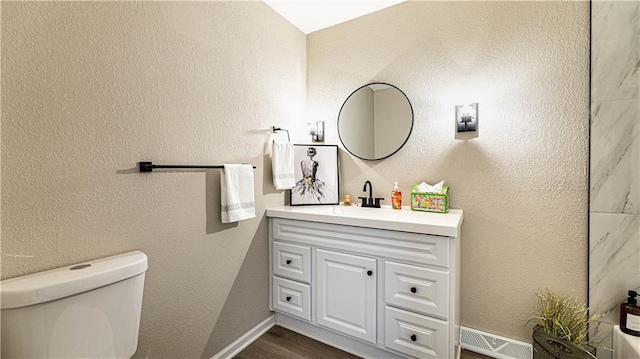 15700 E 202nd St, Peculiar, MO 64078 - bathroom featuring toilet, vanity, wood finished floors, and baseboards