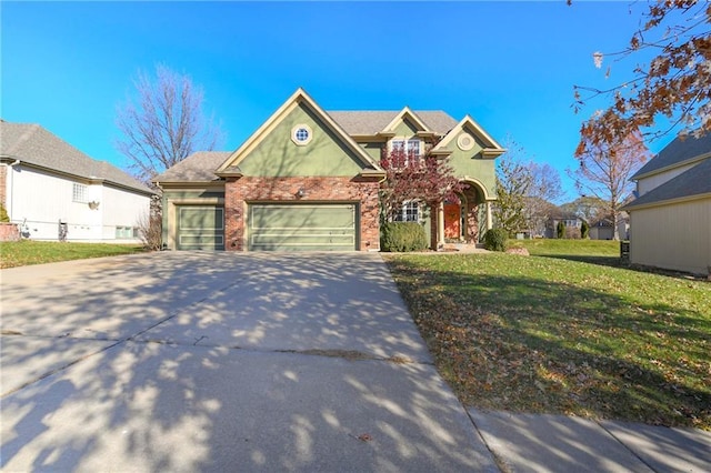 view of front of home with a garage and a front yard