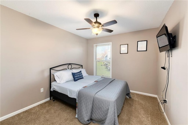 bedroom with light carpet, ceiling fan, and baseboards