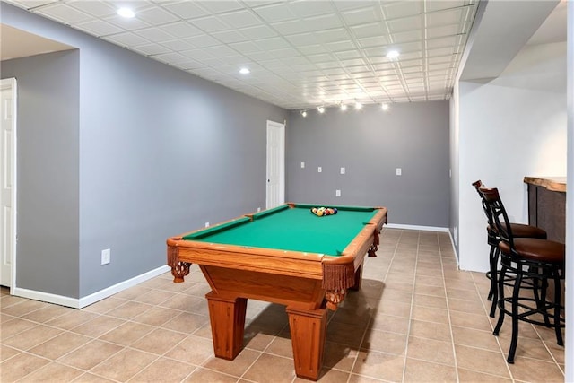 recreation room with pool table, baseboards, and light tile patterned flooring