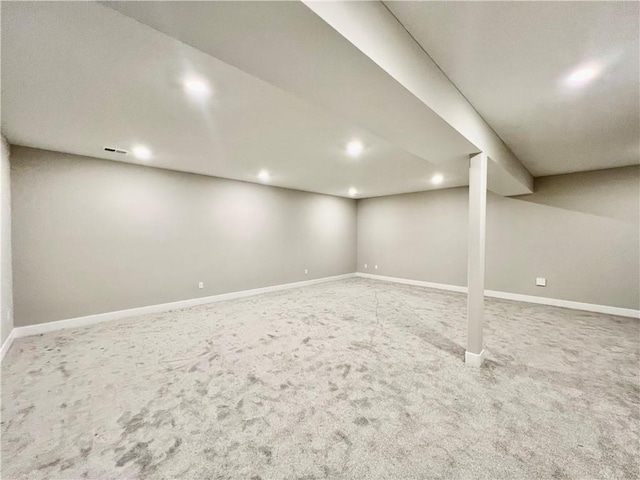 finished basement with baseboards and carpet flooring