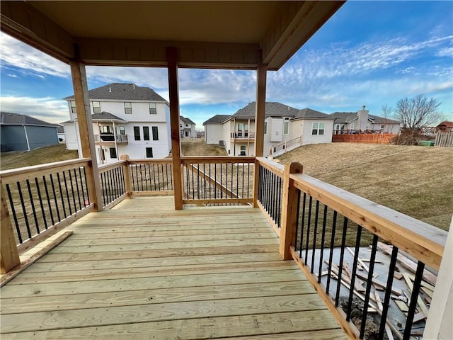 wooden terrace featuring a residential view