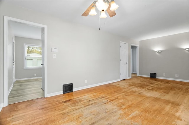 unfurnished room featuring hardwood / wood-style floors and ceiling fan