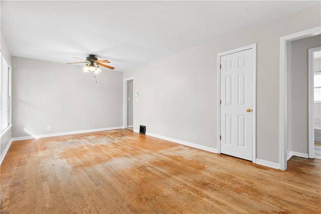 spare room featuring light hardwood / wood-style floors and ceiling fan