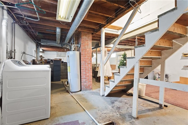 basement with water heater and washing machine and dryer