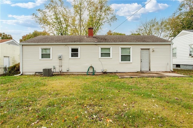 back of house featuring a patio, a yard, and central air condition unit