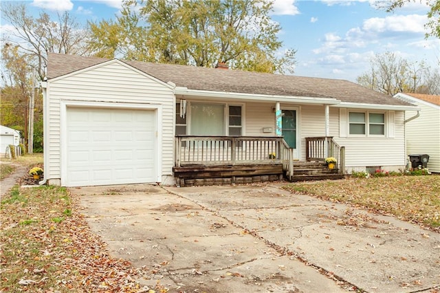 ranch-style house featuring a garage and covered porch