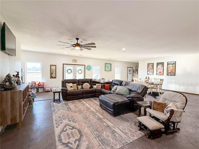 living room with ceiling fan and french doors