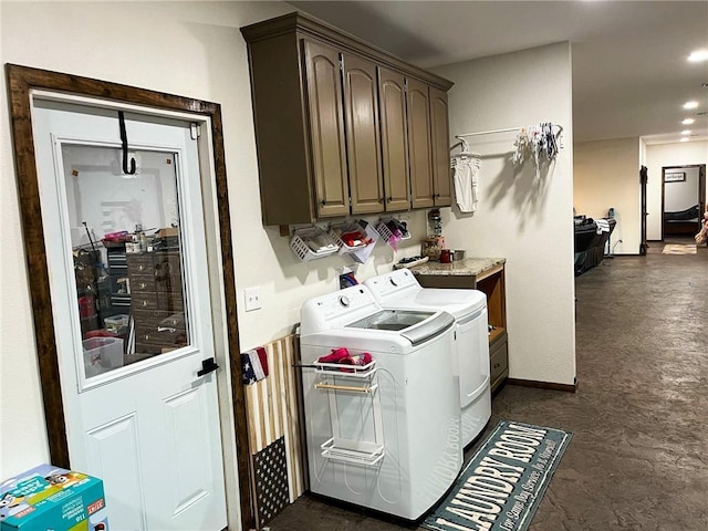 laundry room featuring recessed lighting, baseboards, cabinet space, and washing machine and clothes dryer