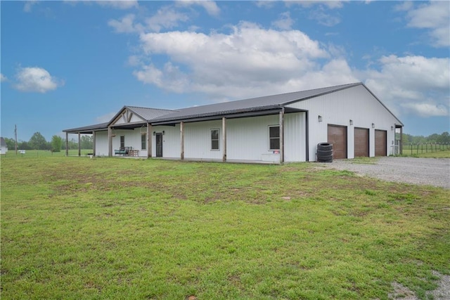 5528 Lostine Rd, Galena, KS 66739 - view of front of property featuring a front lawn, central AC, driveway, and metal roof