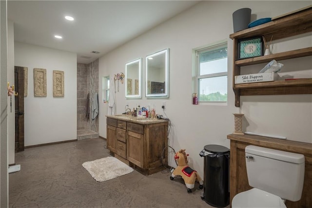 5528 Lostine Rd, Galena, KS 66739 - full bath with vanity, concrete flooring, toilet, recessed lighting, and a walk in shower
