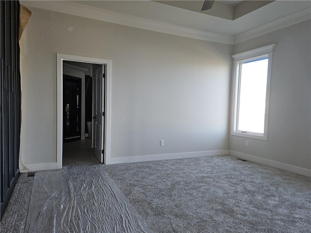 carpeted empty room featuring ornamental molding and ceiling fan