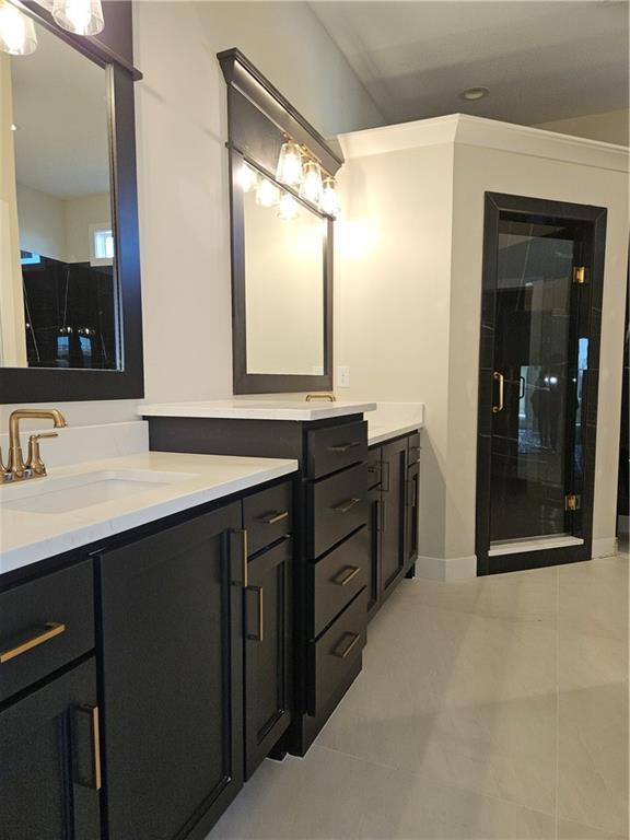 bathroom with vanity and tile patterned floors