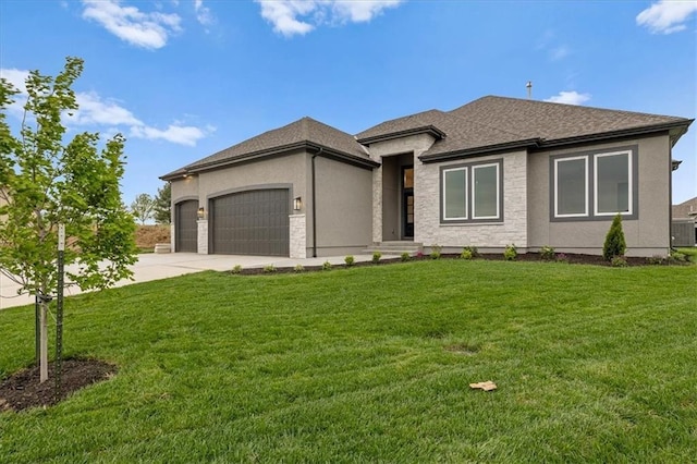 4287 Lake Shore Ct, Basehor, KS 66007 - prairie-style house with stone siding, a garage, stucco siding, a front yard, and concrete driveway