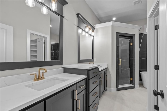 4287 Lake Shore Ct, Basehor, KS 66007 - full bathroom with a shower stall, visible vents, two vanities, and a sink